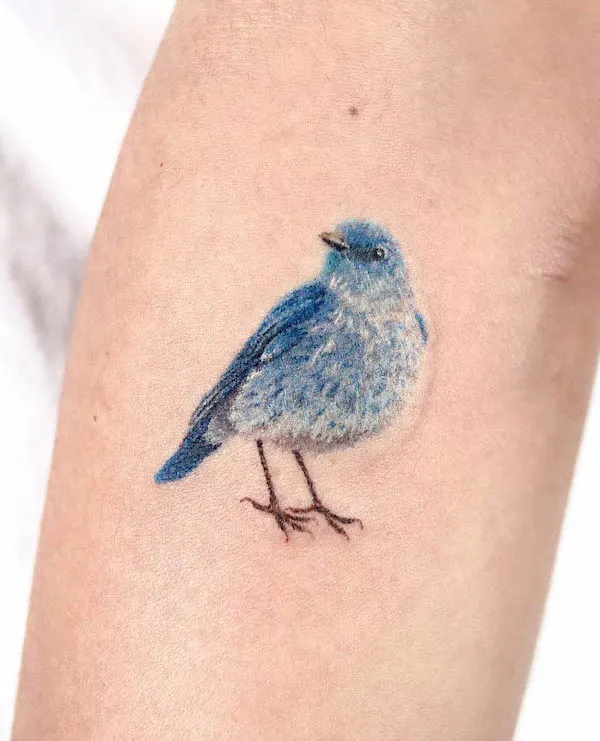 Hand poked blue bird tattoo by @baekya_tt