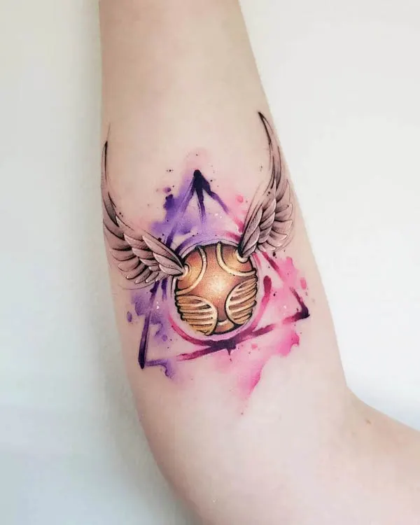 Harry Porter golden snitch tattoo by @true.colors.tattoos