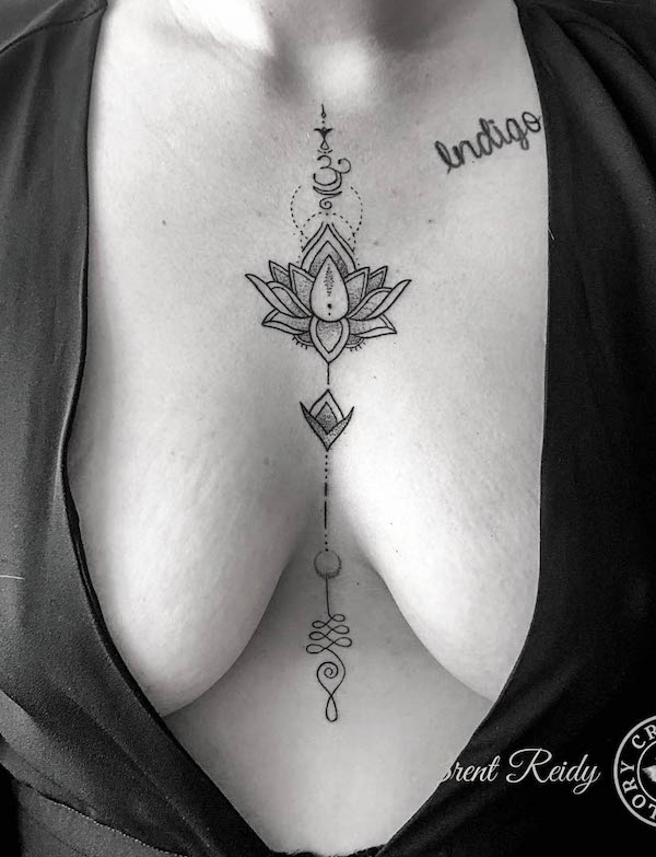Lotus symbol sternum tattoo by @crownandglorytattoo