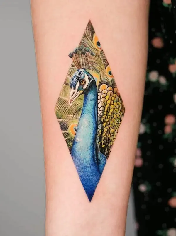 Diamond peacock on the arm by @thommesen_ink