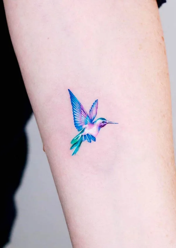 Tiny watercolor bird tattoo by @guseul_tattoo