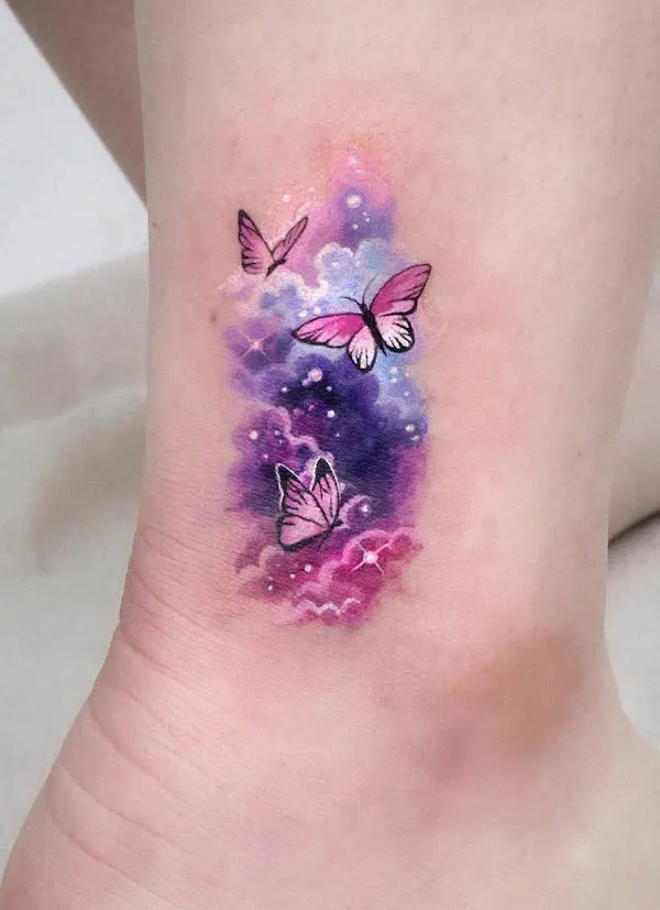 Watercolor butterfly and galaxy tattoo by @tattooist_sigak