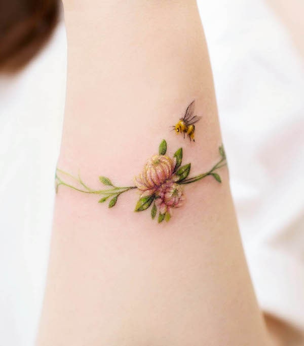 Wristband bee floral tattoo by @ch.tattoo.ahn