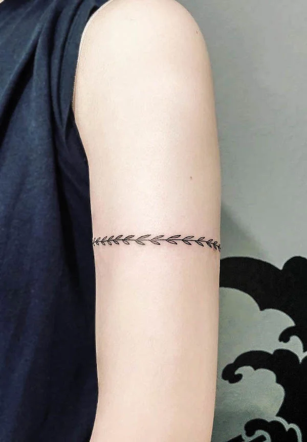 Botanical armband tattoo by @honeybeetattoo_leo