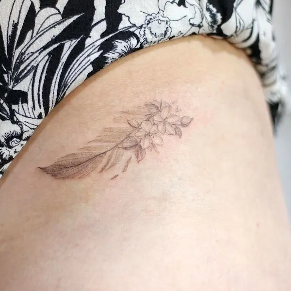 Feather hip tattoo by @laneytattoo