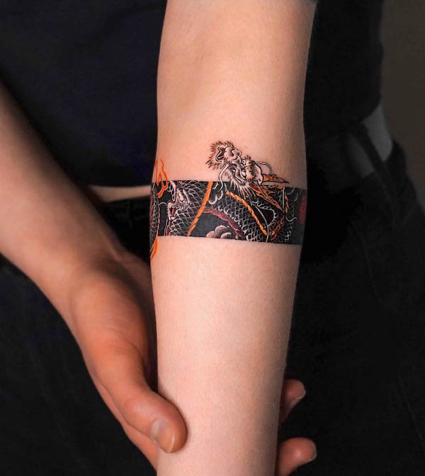 Fierce dragon armband tattoo by @tattooist_eq