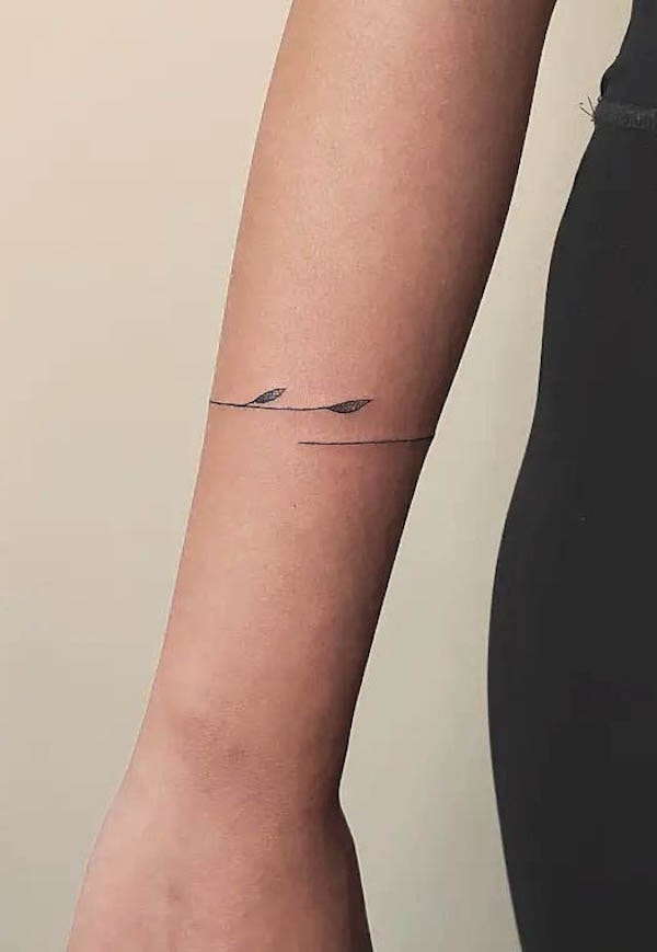 Female simple armband tattoo