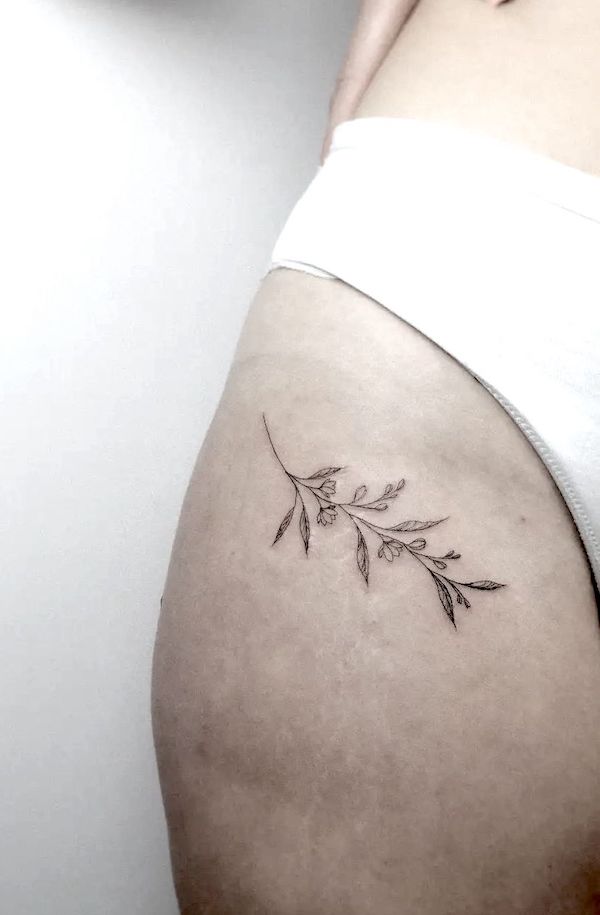 Simple leaves hip tattoo by @julia.em_tattoo