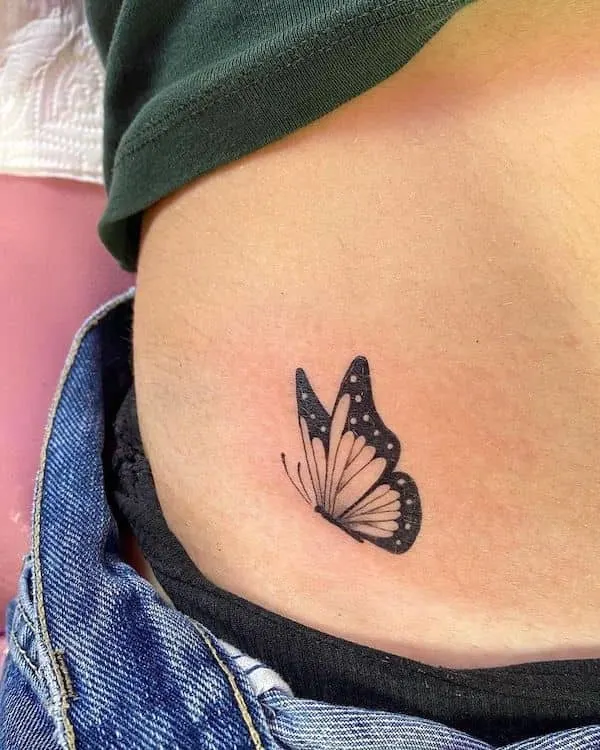 Small butterfly hip tattoo by @triggerhappytattoos