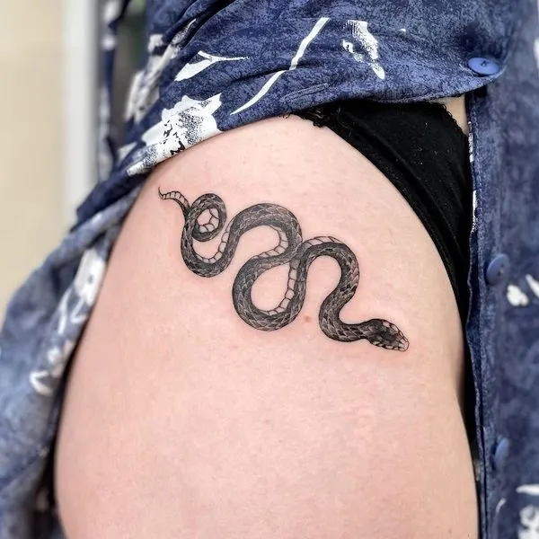 Snake hip tattoo by @leroygiesbers