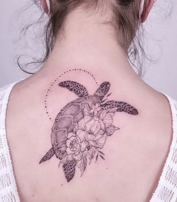 Floral turtle back tattoo by @violaine_tattoo