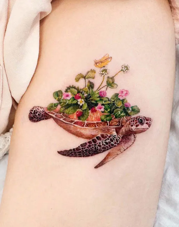 Flowers and sea turtle arm tattoo by @songe.tatto
