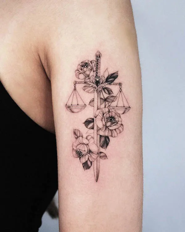 Intricate scale and sword tattoo by @vanya.ink