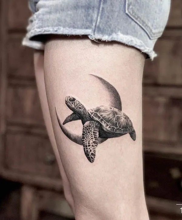 Moon and turtle thigh tattoo by @13ink.tattoo.studio