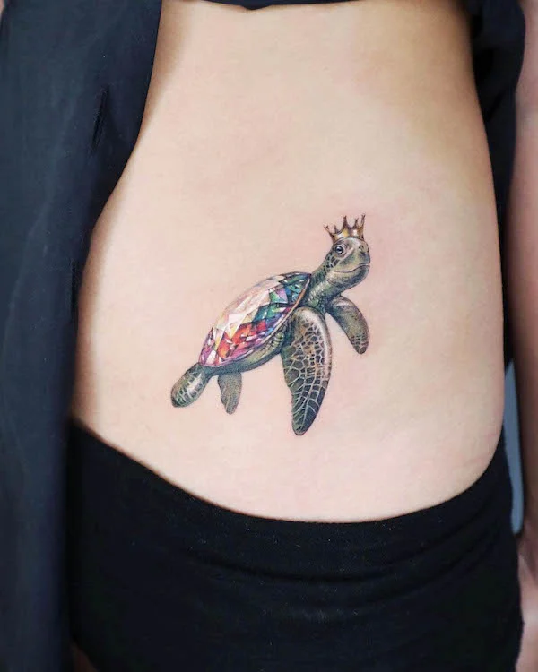 Turtle and crown tattoo by @siia.ink
