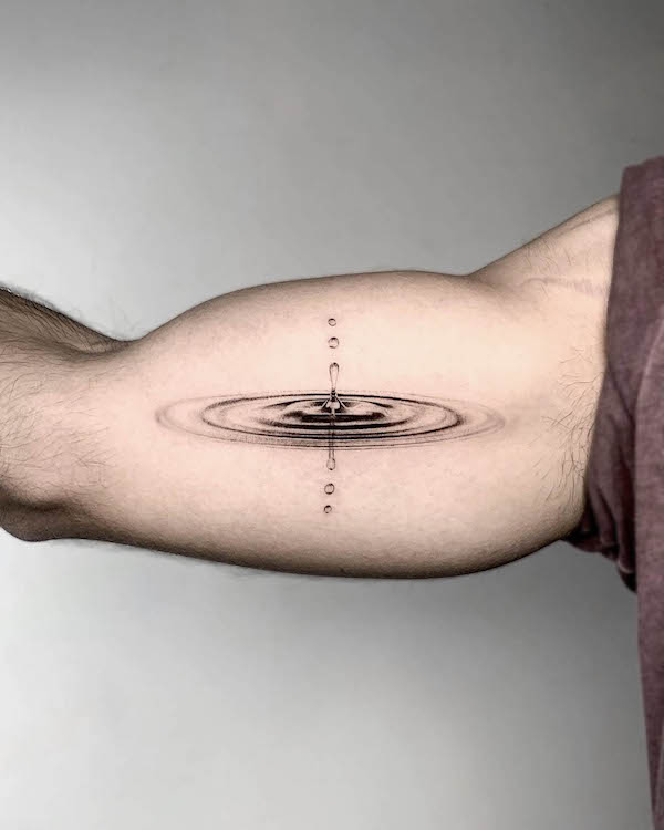 Microrealistic water drop tattoo on the inner arm