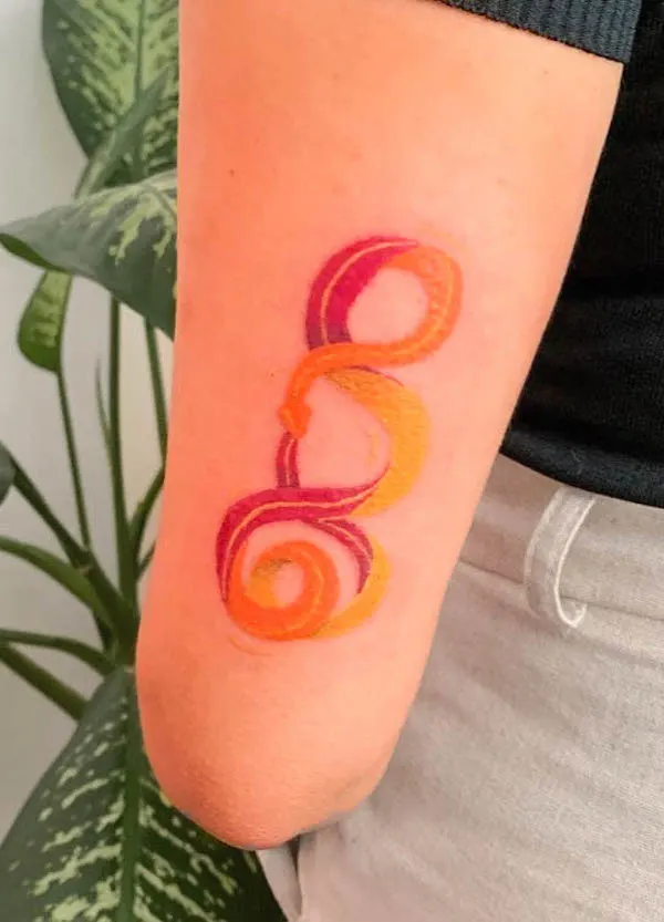Fiery colored ouroboros tattoo by @carolinaabreu.art