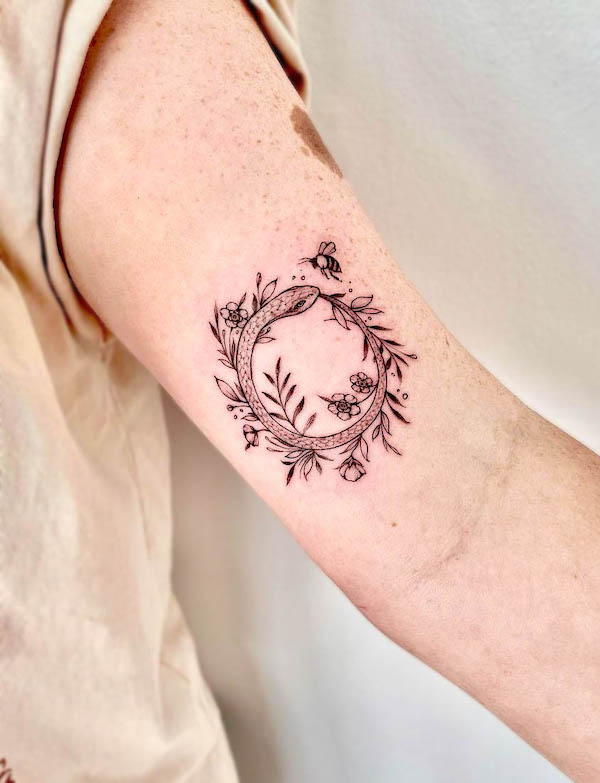 Floral ouroboros and bee tattoo by @smith.ink