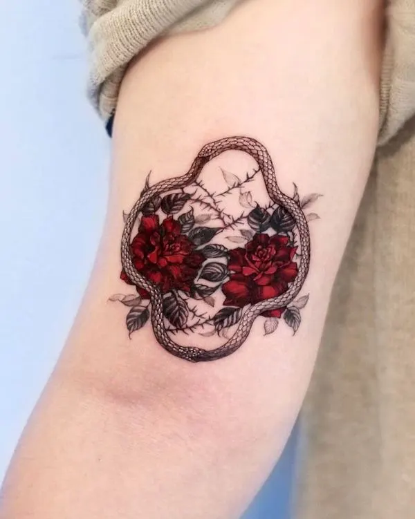 Flowers and irregular ouroboros tattoo by @harusisun