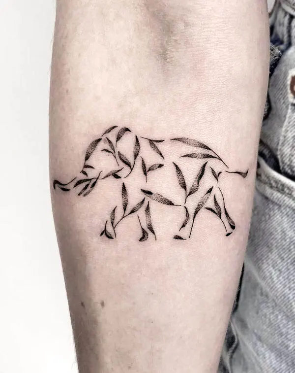 Leaves and elephant tattoo by @louka.tattooist