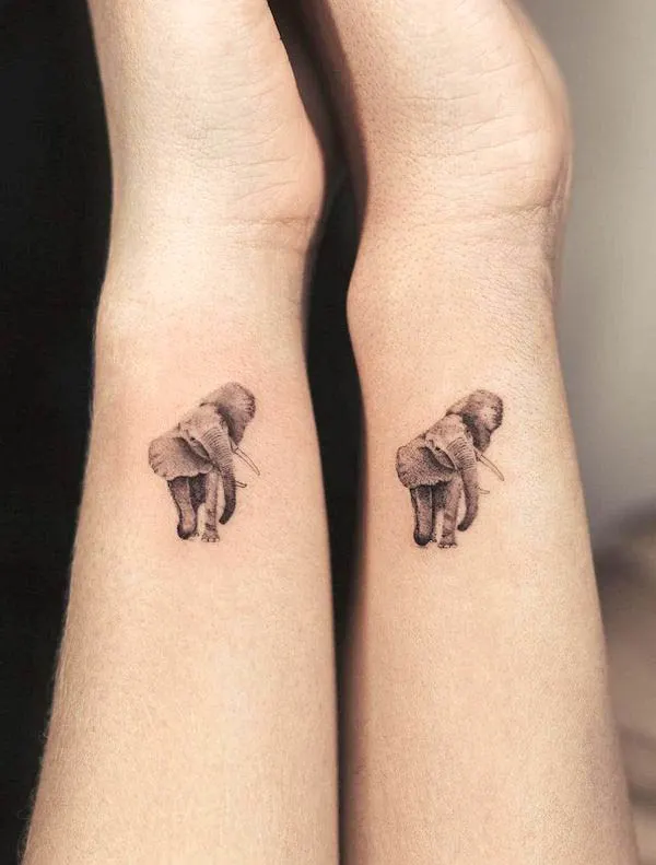 Matching elephant wrist tattoos by @clealtattoo