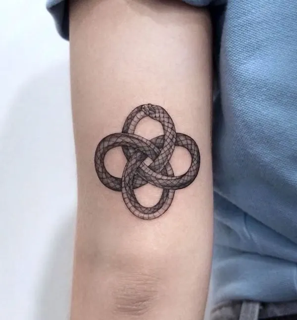 Ouroboros in a knot tattoo by @tattooist_lora