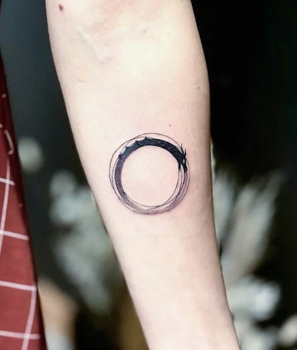 Simple abstract ouroboros tattoo by @minto.tattoo