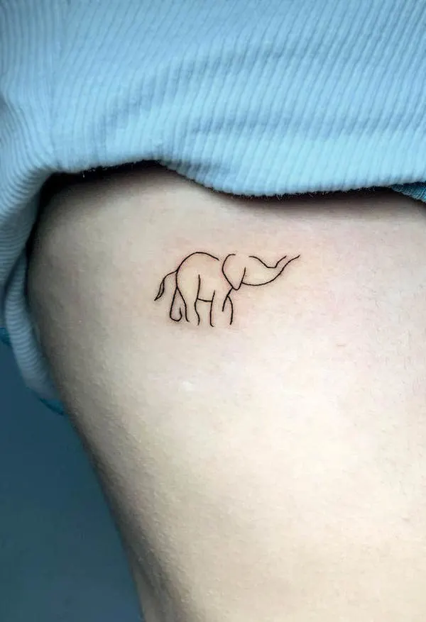 Simple elephant rib tattoo by @dado_ink93