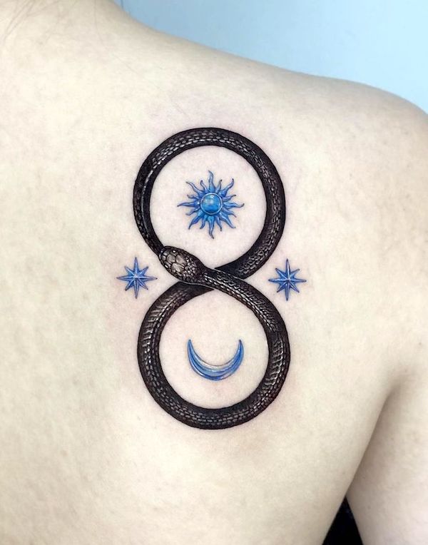Gorgeous blue symbols and ouroboros tattoo by @heek_ink