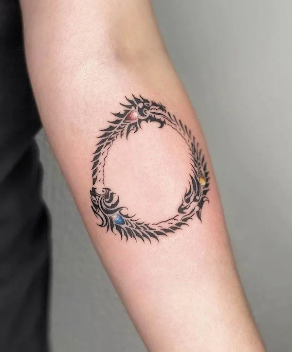 Tribal ouroboros tattoo by @_vinnyink