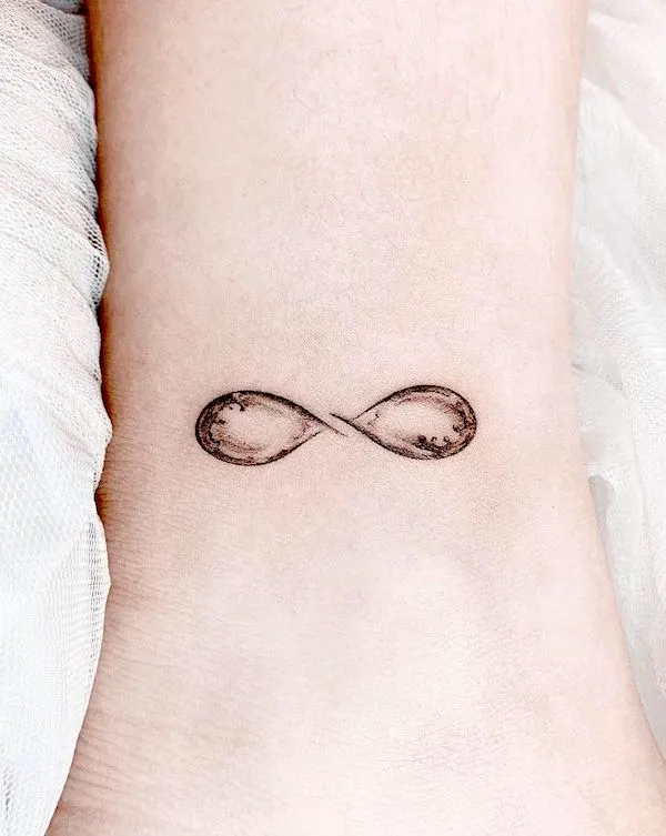Black Line Studio | Infinity sign tattoos are a popular choice due to their  simple yet profound symbolism. The infinity symbol (∞) represents eternity,  emp... | Instagram