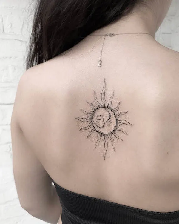 Bold sun and moon back tattoo by @looka.tattoo