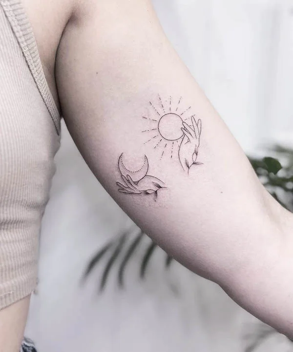 Cute sun and moon bicep tattoo by @nothingsrs