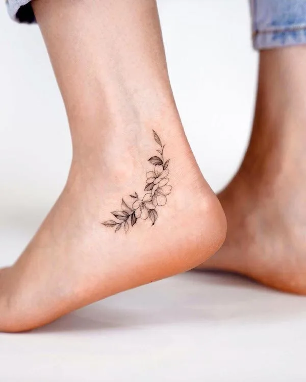 Flower anklet tattoo