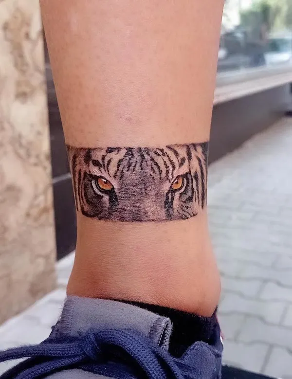 Eyes of tiger ankle tattoo by @angel.s_tatt