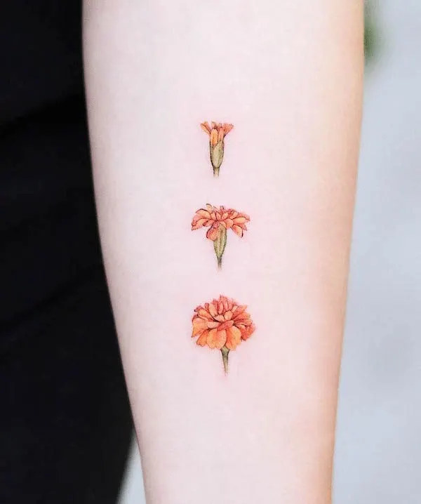 Marigold October birth flower tattoo by @hnnhtattoo
