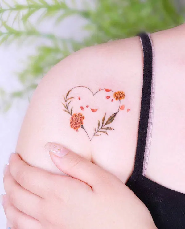 Marigold October birth flower tattoo by @peria_tattoo
