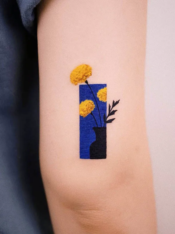 Marigold October birth flower tattoo by @youngchickentattoo