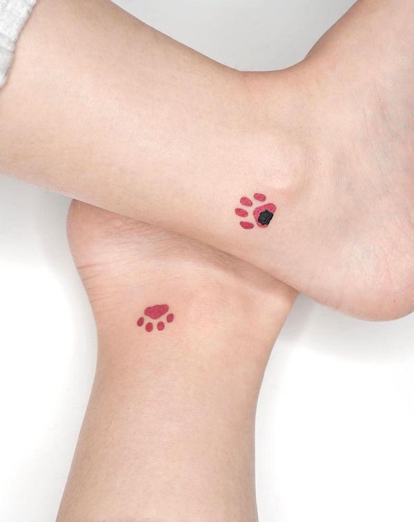 Matching paws ankle tattoo by @simya_tattoo
