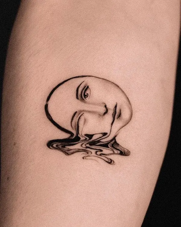 Melting face arm tattoo by @claudiag.tattoo