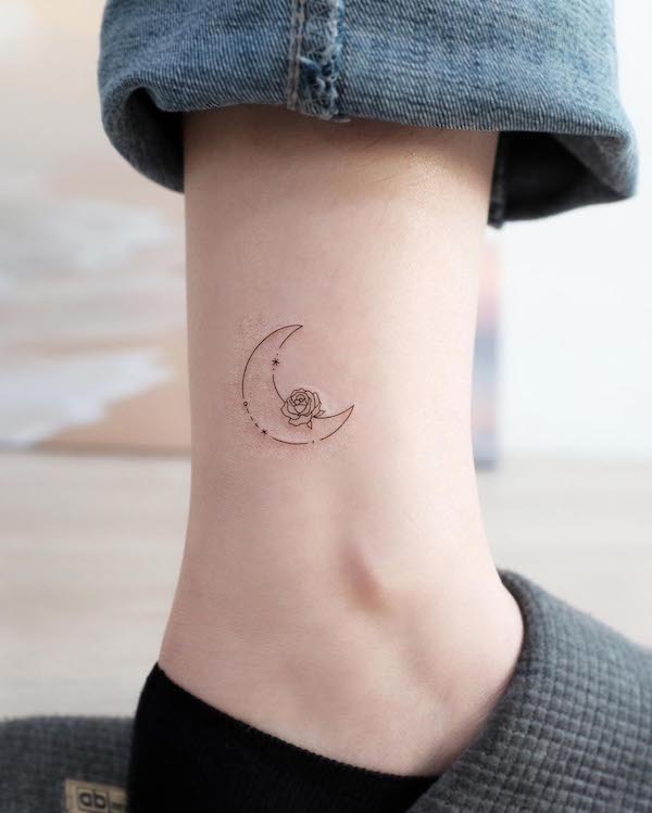 Simple moon and flower ankle tattoo by @lime_tattoo
