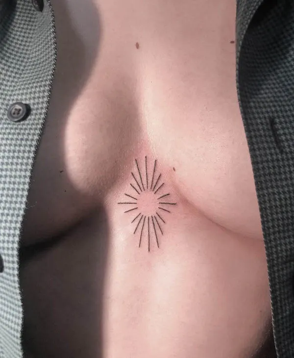 Sun tattoo between boobs by @yamiitats