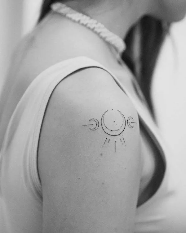 Symbolic sun and moon shoulder tattoo by @arinatattoo