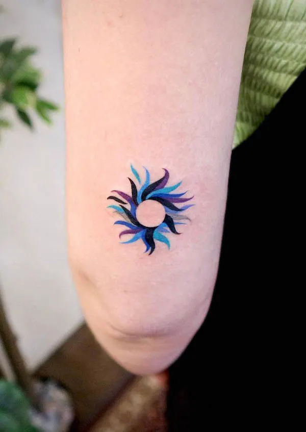 The blue sun elbow tattoo by @rolypolyc