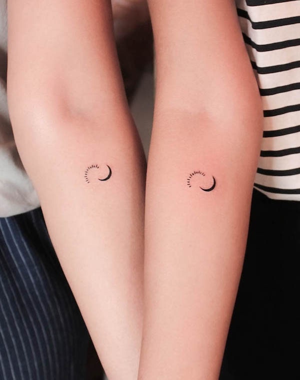Tiny sun and moon matching tattoos by @blackpoisontattoos
