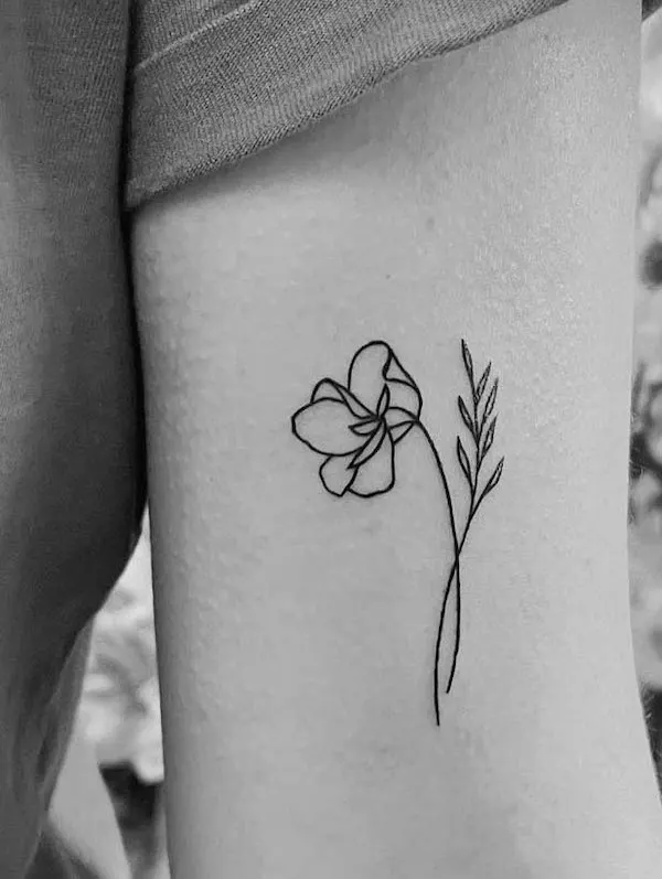Violet February birth flower tattoo by @patricia.regina.tattoo