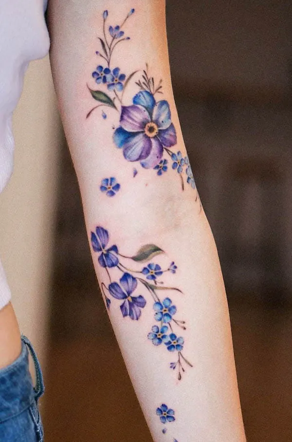 Violet February birth flower tattoo by @veroni.ink
