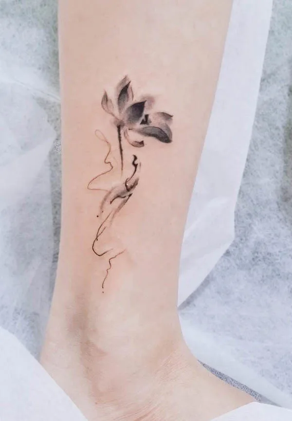 Water lily July birth flower tattoo by @miuzzyinktattoostudio