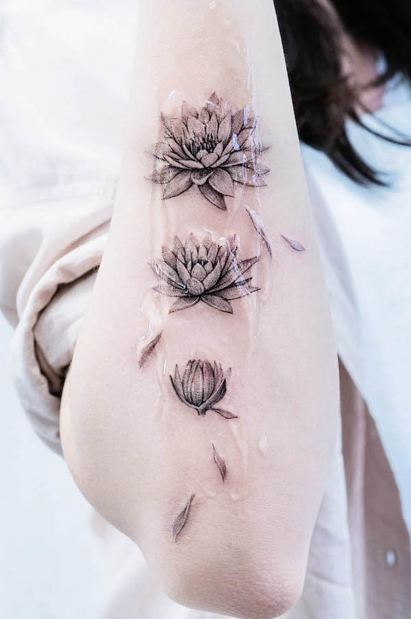 Water lily July birth flower tattoo by @tattooist_color.b