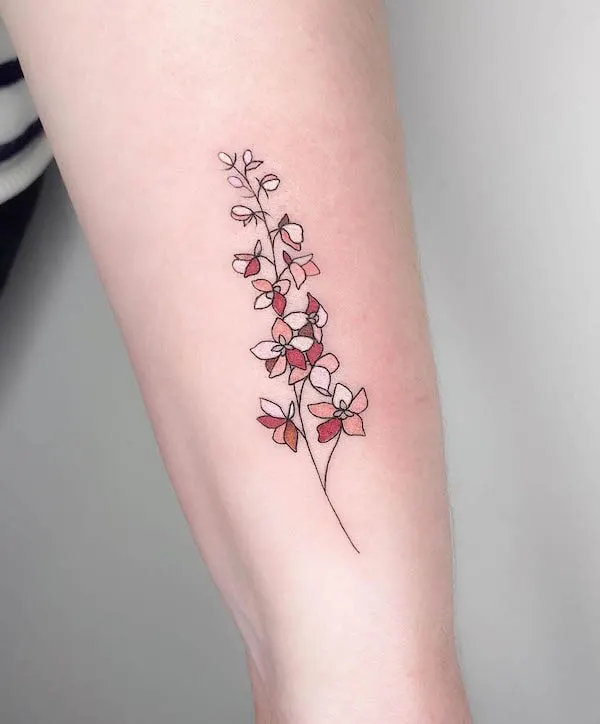 larkspur July birth flower tattoo by @muk.tatouage
